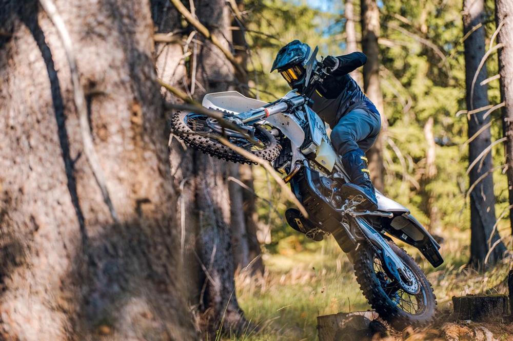 FE 350 Pro being ridden in a forest